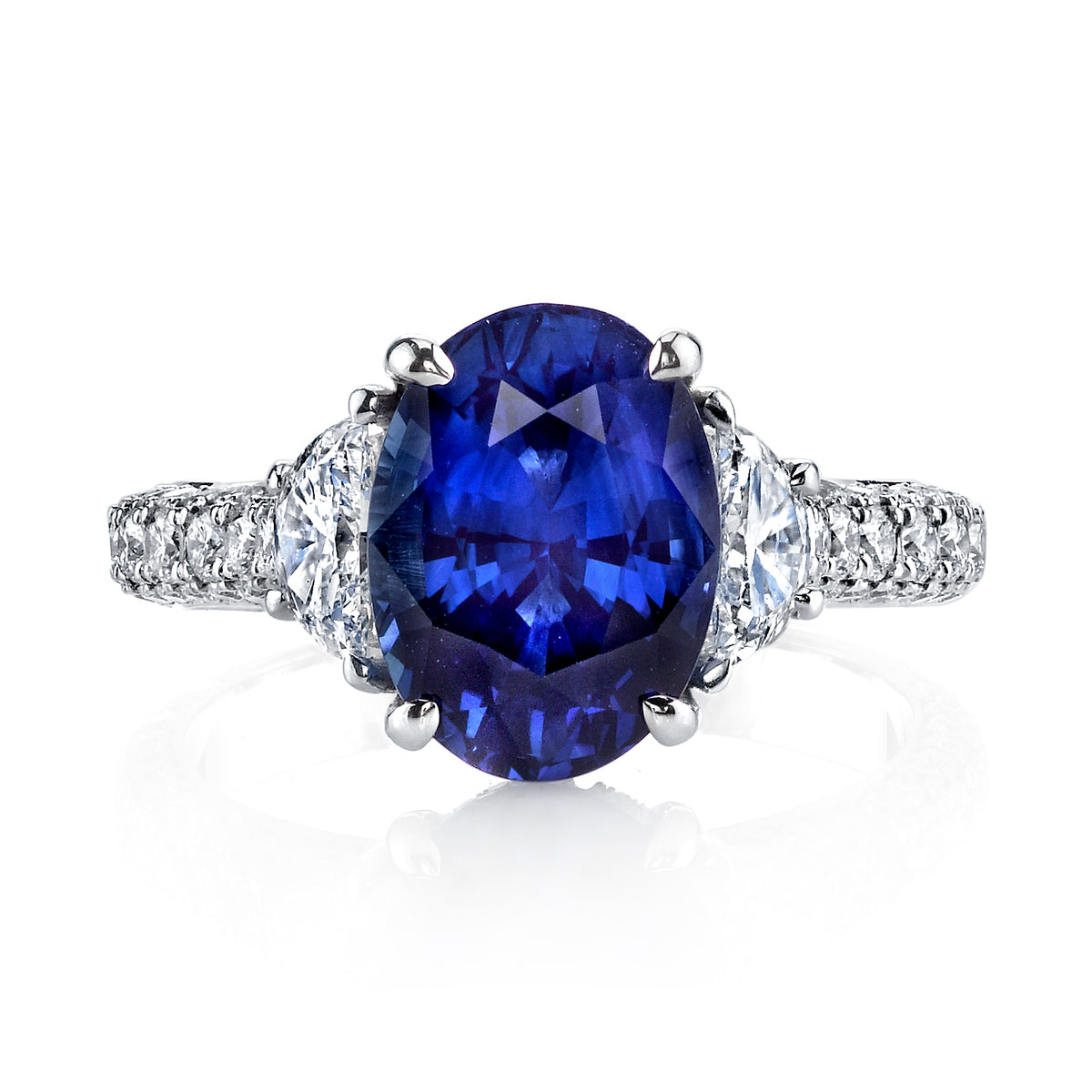 Manfredi Jewels Engagement - Oval Blue Sapphire 4.39ct Three-Stone Ring with Half-Moon Diamond Side Stones and Triple-Row Micro Pavé Band